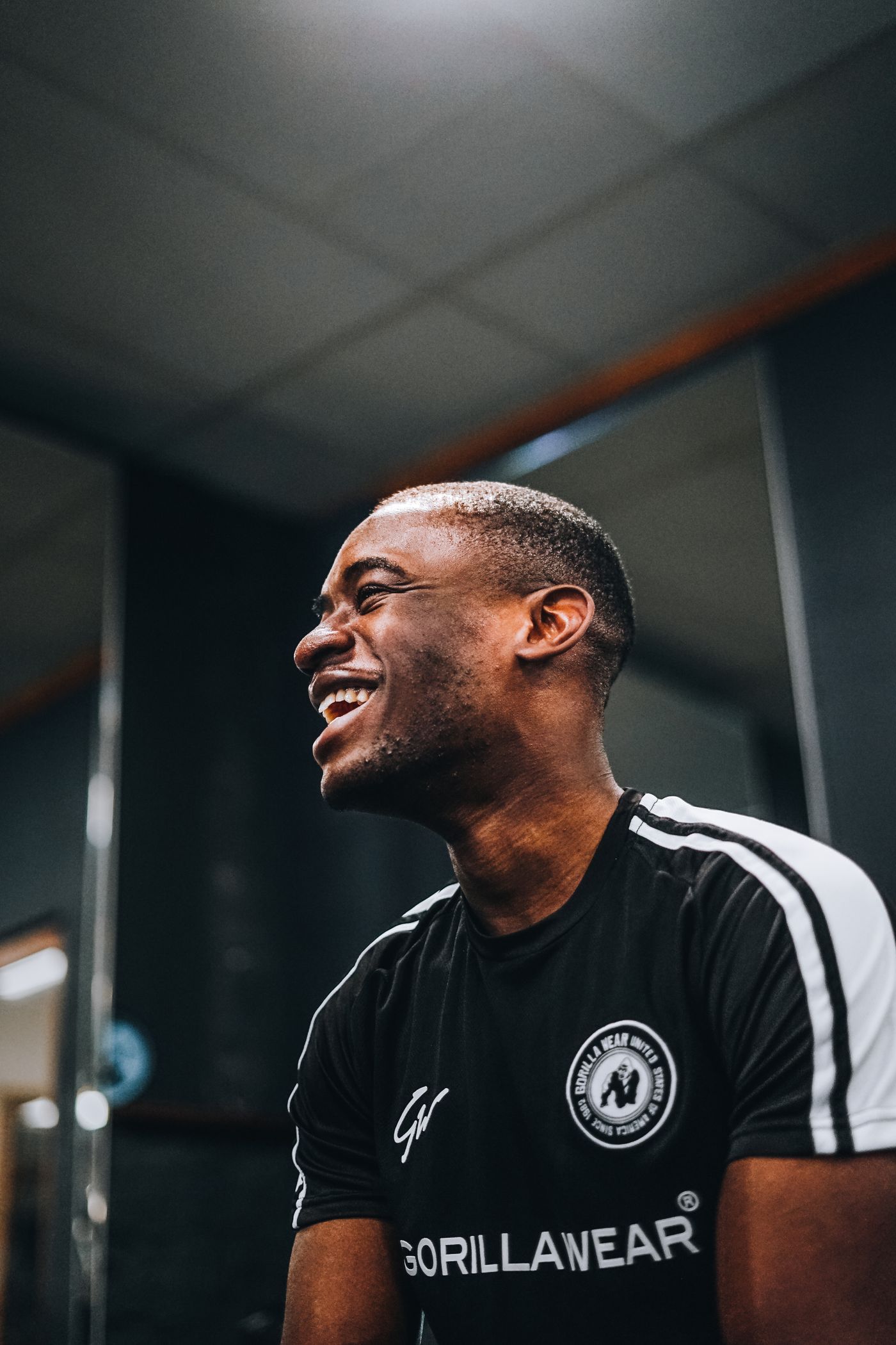 Professional fitness coach smiling in a training studio