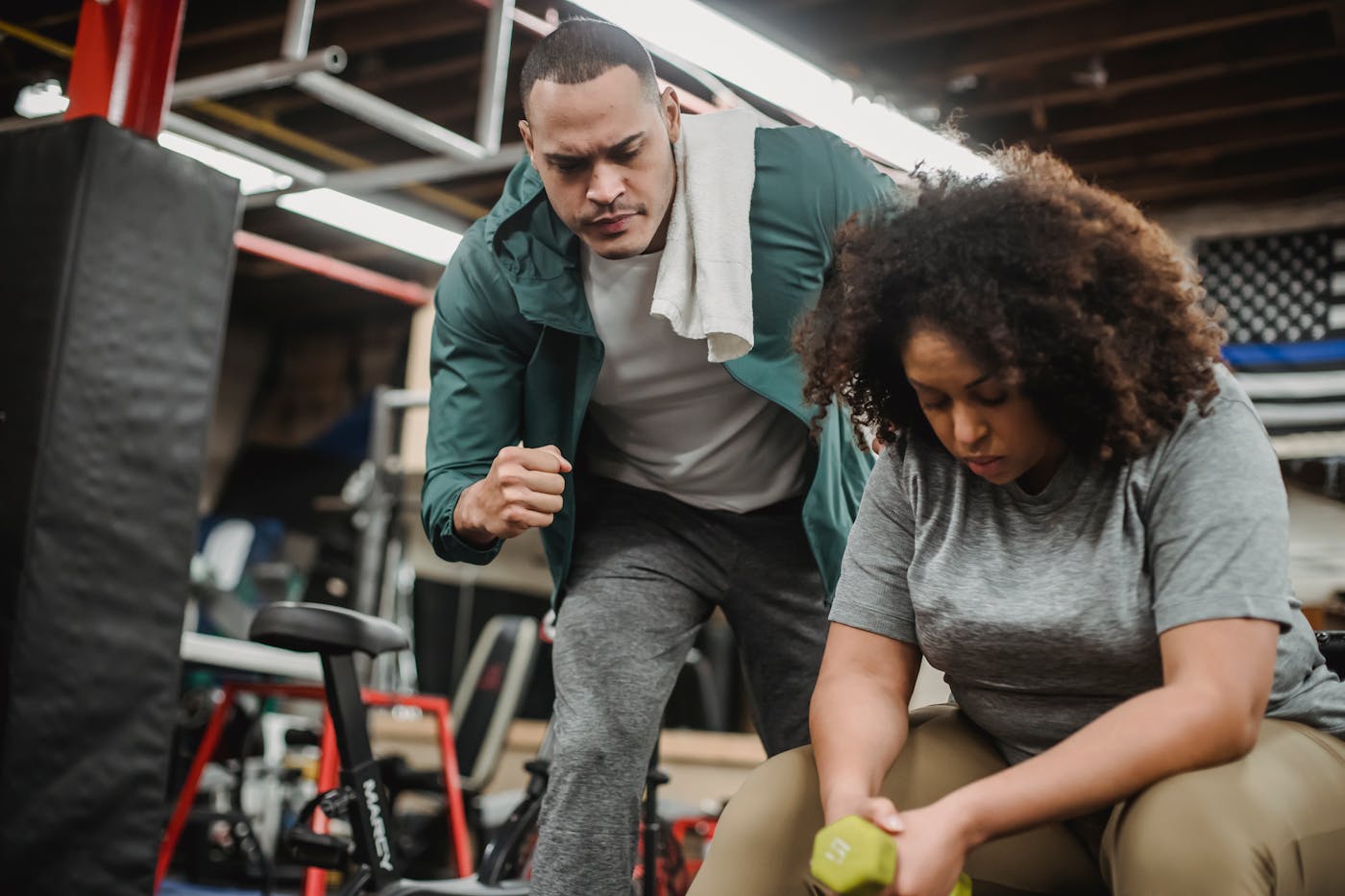 Trainer coaching a client during a one-on-one workout